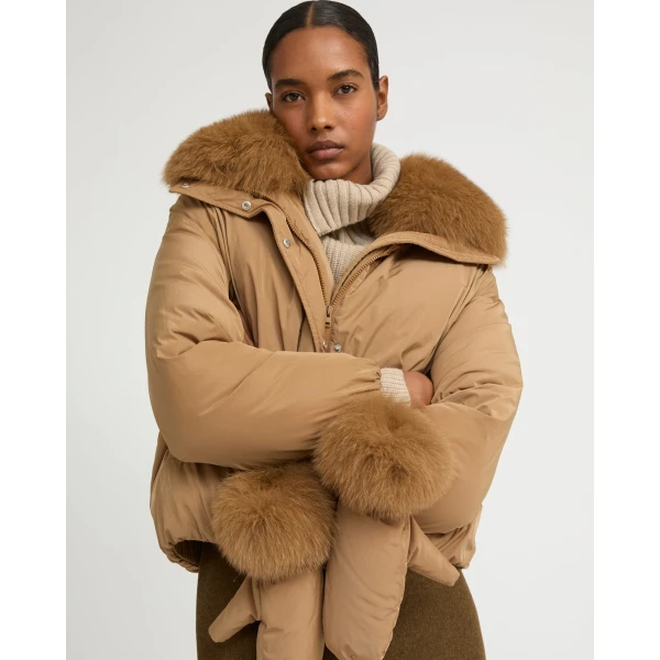 Woman wearing Yves Salomon shearling fur coat – luxury outerwear at Luxury Shoes 
