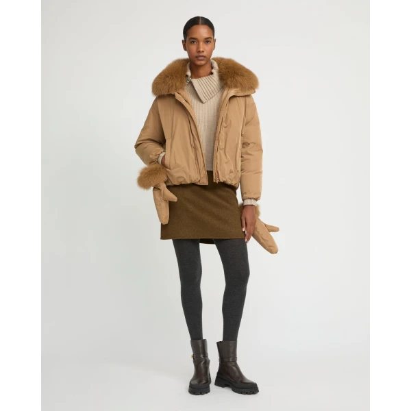 Woman wearing Yves Salomon shearling fur coat – luxury outerwear at Luxury Shoes 