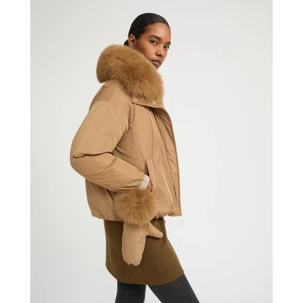 Woman wearing Yves Salomon shearling fur coat – luxury outerwear at Luxury Shoes 