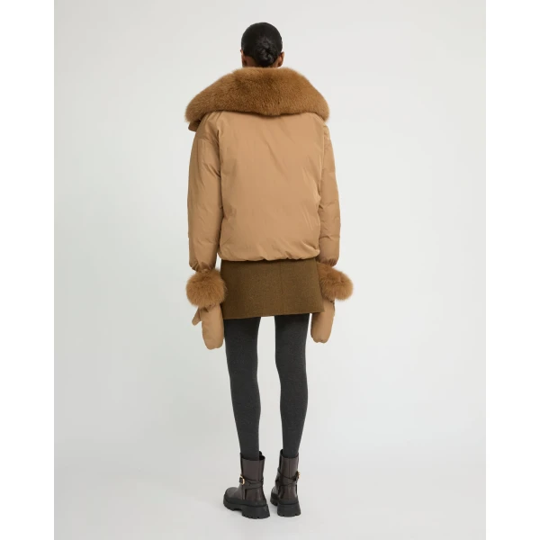 Woman wearing Yves Salomon shearling fur coat – luxury outerwear at Luxury Shoes 