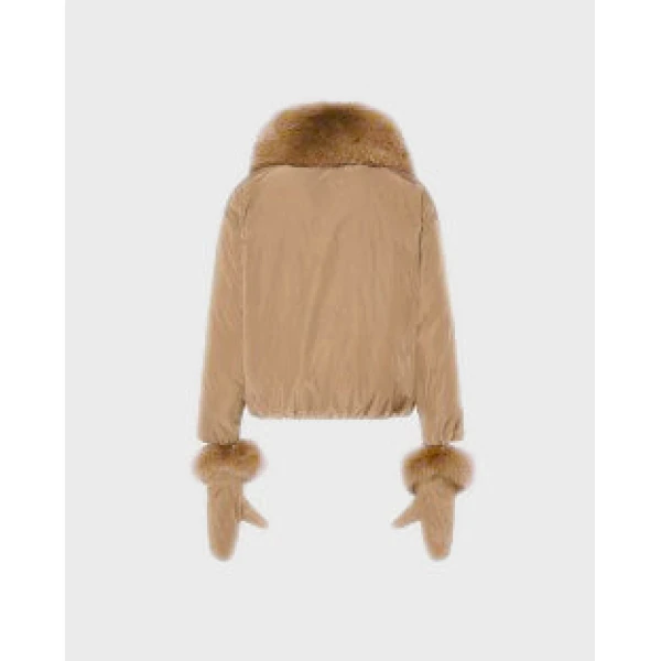 Woman wearing Yves Salomon shearling fur coat – luxury outerwear at Luxury Shoes 