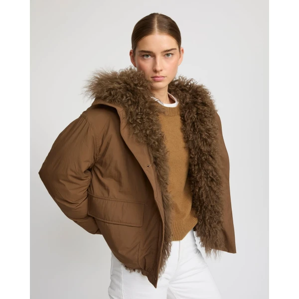 Woman wearing Yves Salomon shearling fur coat – luxury outerwear at Luxury Shoes 