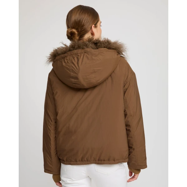Woman wearing Yves Salomon shearling fur coat – luxury outerwear at Luxury Shoes 