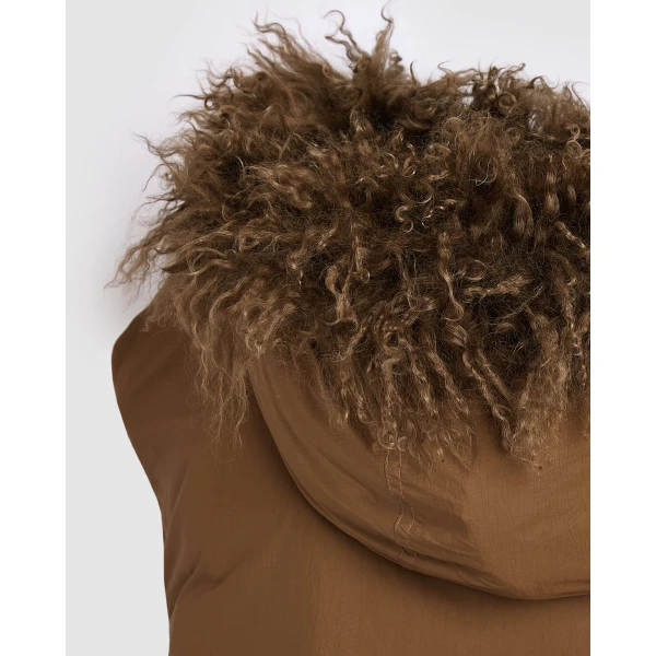 Woman wearing Yves Salomon shearling fur coat – luxury outerwear at Luxury Shoes 