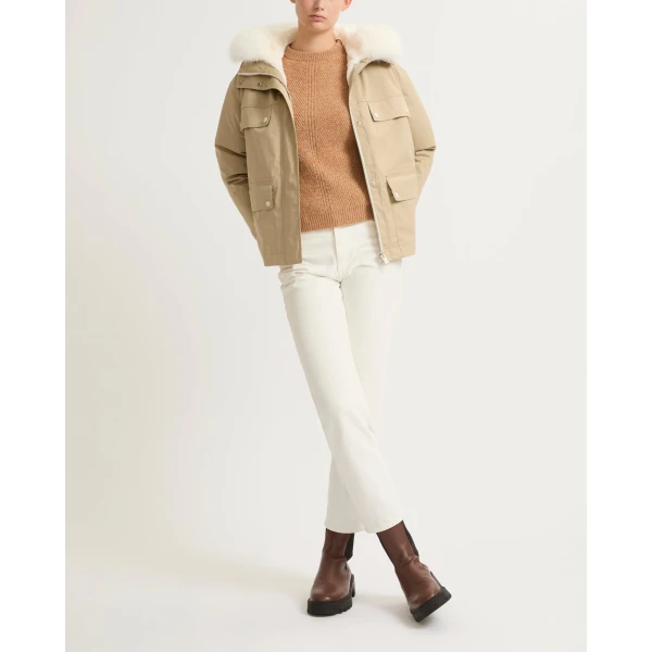 Woman wearing Yves Salomon shearling fur coat – luxury outerwear at Luxury Shoes 