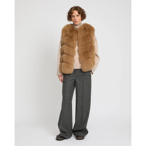 Woman wearing Yves Salomon shearling fur coat – luxury outerwear at Luxury Shoes 