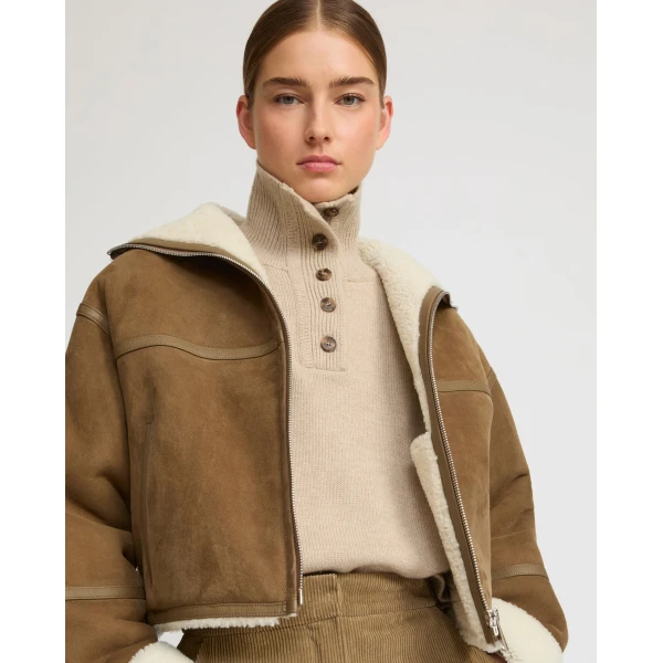 Woman wearing Yves Salomon shearling fur coat – luxury outerwear at Luxury Shoes 