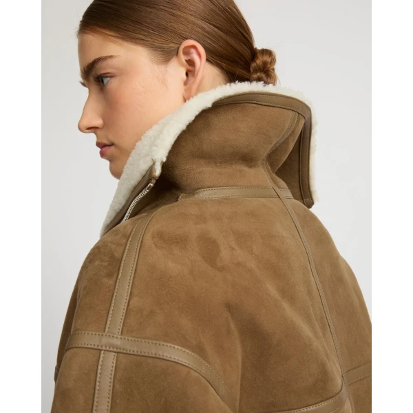 Woman wearing Yves Salomon shearling fur coat – luxury outerwear at Luxury Shoes 
