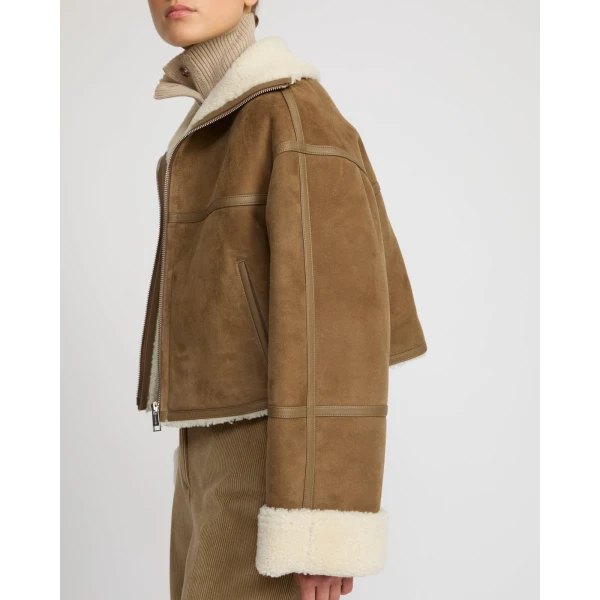 Woman wearing Yves Salomon shearling fur coat – luxury outerwear at Luxury Shoes 