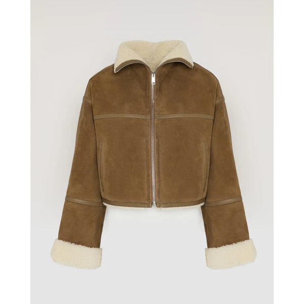 Woman wearing Yves Salomon shearling fur coat – luxury outerwear at Luxury Shoes 