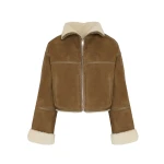 Woman wearing Yves Salomon shearling fur coat – luxury outerwear at Luxury Shoes 