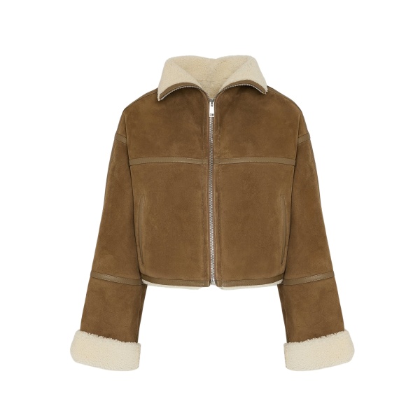 Woman wearing Yves Salomon shearling fur coat – luxury outerwear at Luxury Shoes 