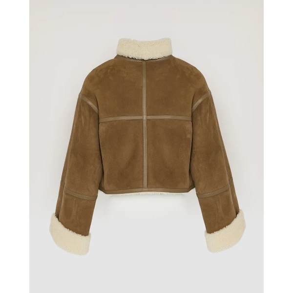 Woman wearing Yves Salomon shearling fur coat – luxury outerwear at Luxury Shoes 