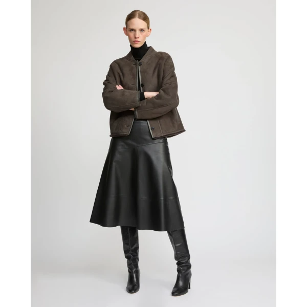 Woman wearing Yves Salomon shearling fur coat – luxury outerwear at Luxury Shoes 