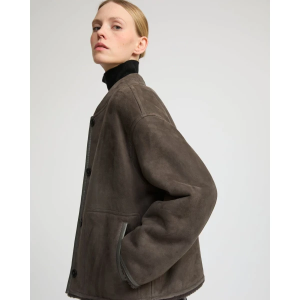 Woman wearing Yves Salomon shearling fur coat – luxury outerwear at Luxury Shoes 