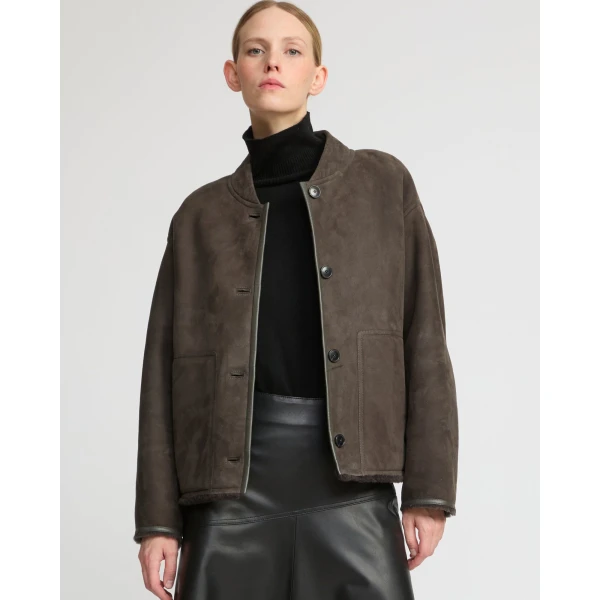 Woman wearing Yves Salomon shearling fur coat – luxury outerwear at Luxury Shoes 