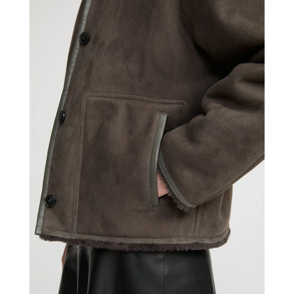 Woman wearing Yves Salomon shearling fur coat – luxury outerwear at Luxury Shoes 