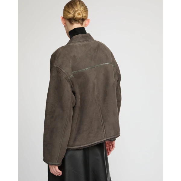Woman wearing Yves Salomon shearling fur coat – luxury outerwear at Luxury Shoes 