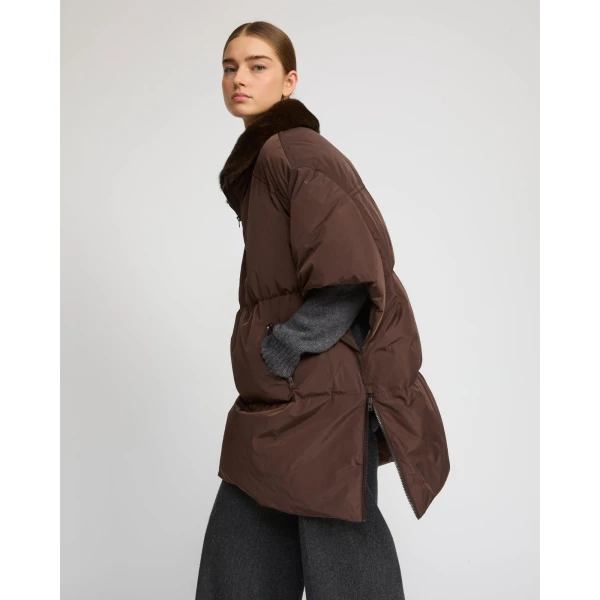 Woman wearing Yves Salomon shearling fur coat – luxury outerwear at Luxury Shoes 
