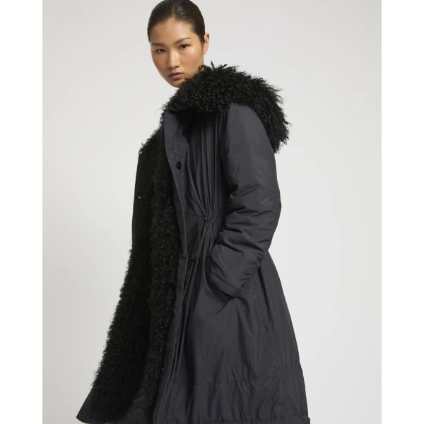 Woman wearing Yves Salomon shearling fur coat – luxury outerwear at Luxury Shoes 