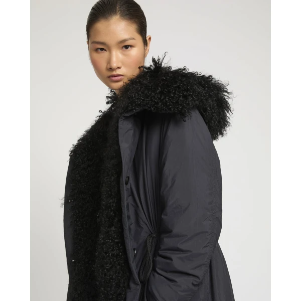 Woman wearing Yves Salomon shearling fur coat – luxury outerwear at Luxury Shoes 