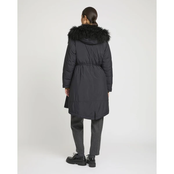Woman wearing Yves Salomon shearling fur coat – luxury outerwear at Luxury Shoes 