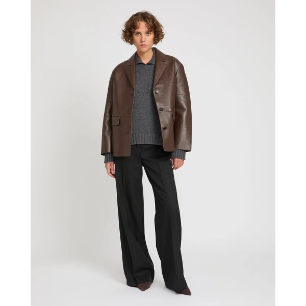 Woman wearing Yves Salomon shearling fur coat – luxury outerwear at Luxury Shoes 