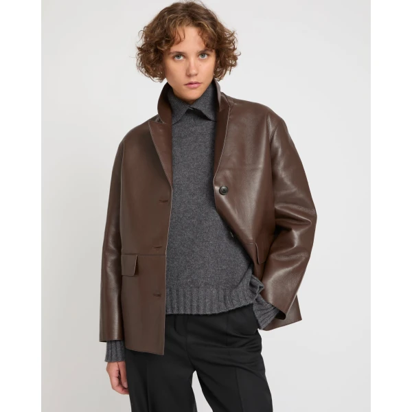 Woman wearing Yves Salomon shearling fur coat – luxury outerwear at Luxury Shoes 