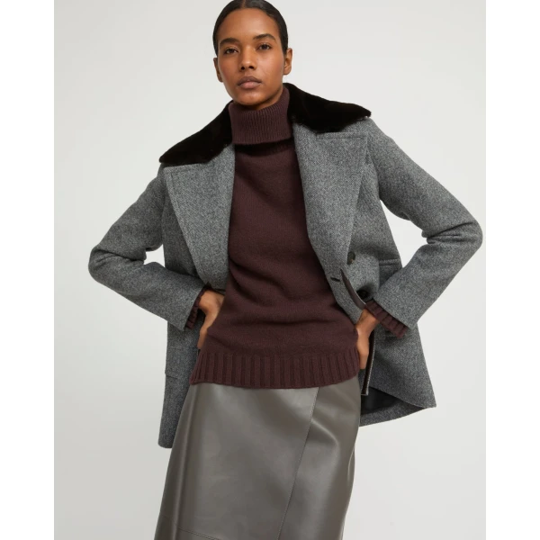Woman wearing Yves Salomon shearling fur coat – luxury outerwear at Luxury Shoes 