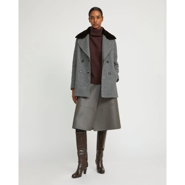 Woman wearing Yves Salomon shearling fur coat – luxury outerwear at Luxury Shoes 