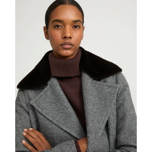Woman wearing Yves Salomon shearling fur coat – luxury outerwear at Luxury Shoes 