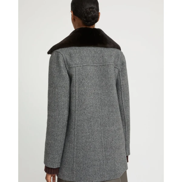 Woman wearing Yves Salomon shearling fur coat – luxury outerwear at Luxury Shoes 