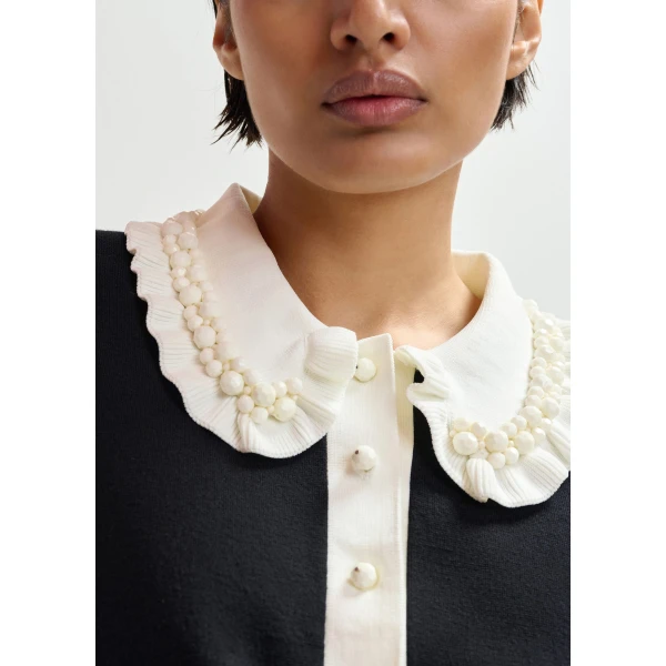 Essentiel Antwerp Black and off-white ruffle fine-knit polo top with bead embellishments - Essentiel Antwerp Tops - Colorful Belgian Design - Shop at Luxury Shoes 