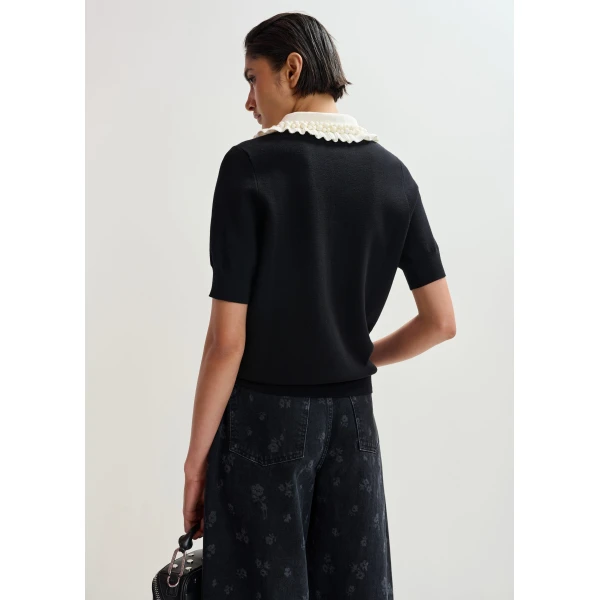 Essentiel Antwerp Black and off-white ruffle fine-knit polo top with bead embellishments - Essentiel Antwerp Tops - Colorful Belgian Design - Shop at Luxury Shoes 