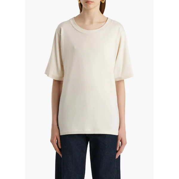 Elevate your elegance in this Khaite Tops   from the 2025 resort wear edit