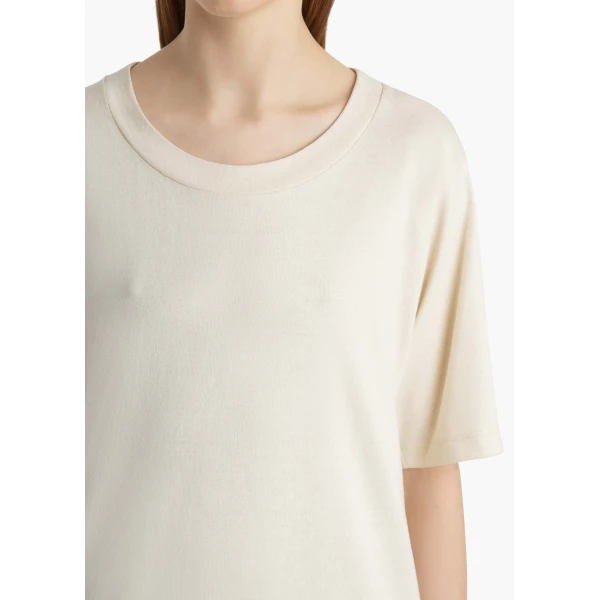 Elevate your elegance in this Khaite Tops   from the 2025 resort wear edit
