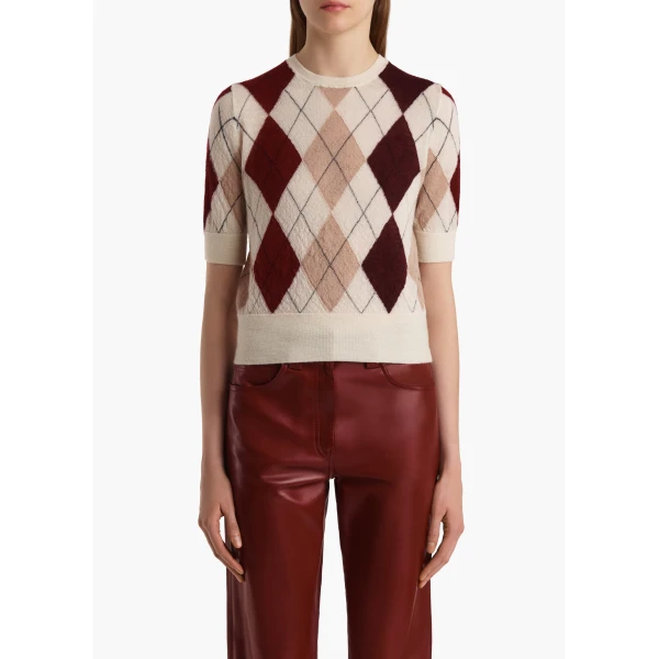 Elevate your elegance in this Khaite Tops   from the 2025 resort wear edit