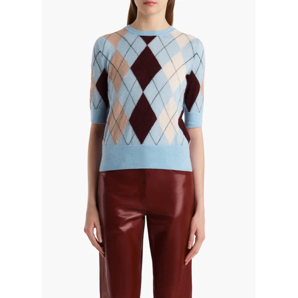 Elevate your elegance in this Khaite Tops   from the 2025 resort wear edit