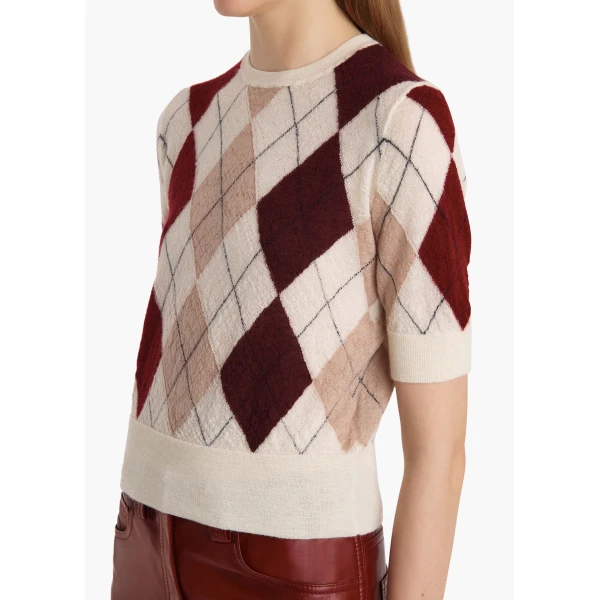 Elevate your elegance in this Khaite Tops   from the 2025 resort wear edit