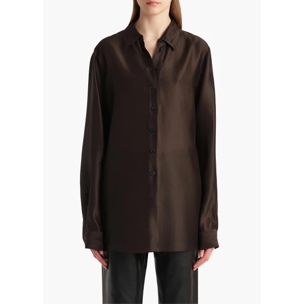 Elevate your elegance in this Khaite Tops   from the 2025 resort wear edit
