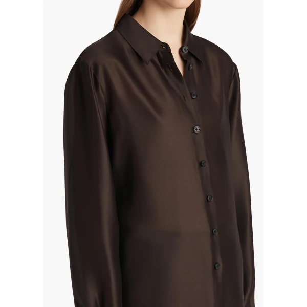 Elevate your elegance in this Khaite Tops   from the 2025 resort wear edit