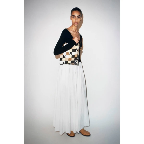 Elevate your elegance in this Khaite Dresses   from the 2025 resort wear edit