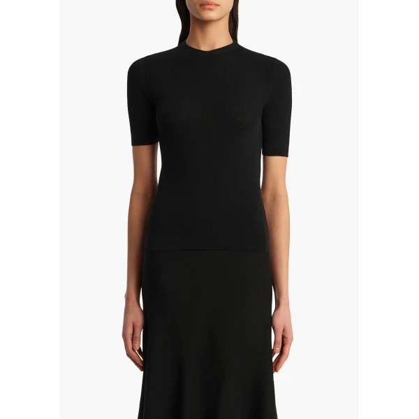 Elevate your elegance in this Khaite Tops   from the 2025 resort wear edit