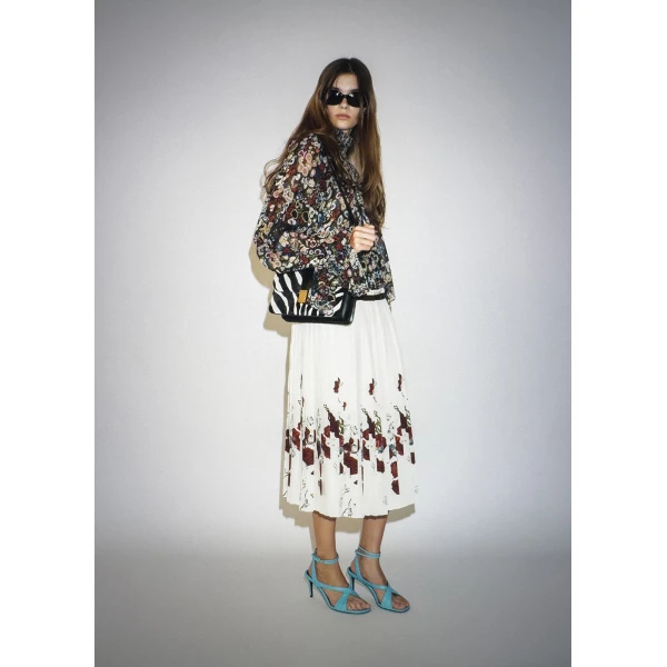 Elevate your elegance in this Khaite Tops   from the 2025 resort wear edit