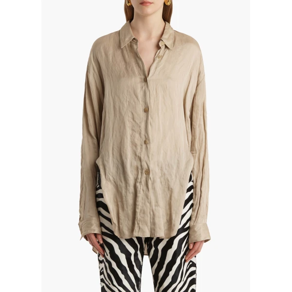 Elevate your elegance in this Khaite Tops   from the 2025 resort wear edit
