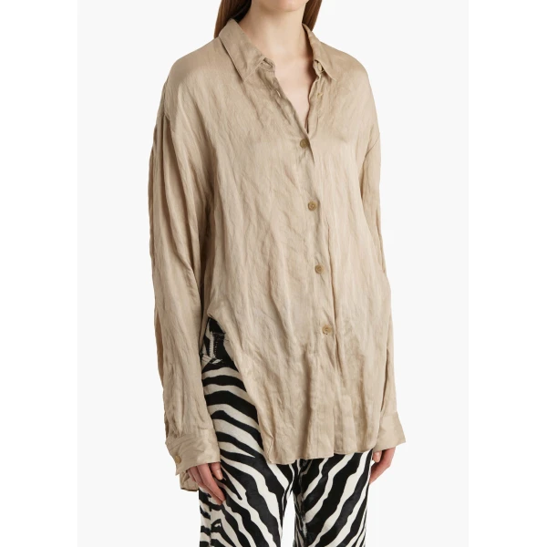 Elevate your elegance in this Khaite Tops   from the 2025 resort wear edit