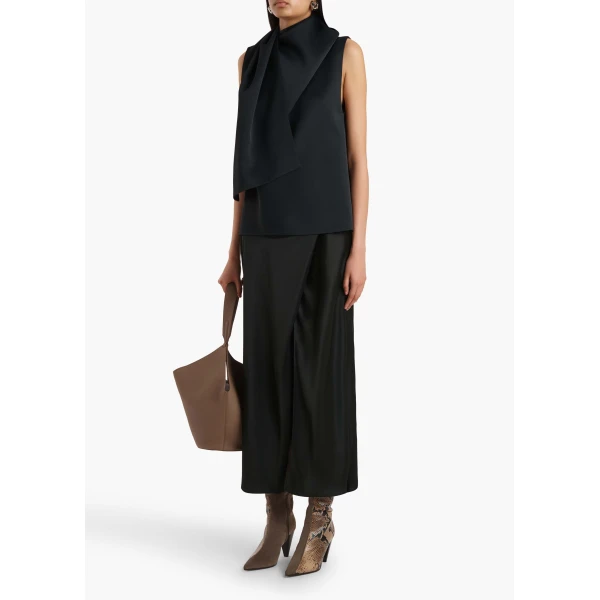 Elevate your elegance in this Khaite Tops   from the 2025 resort wear edit