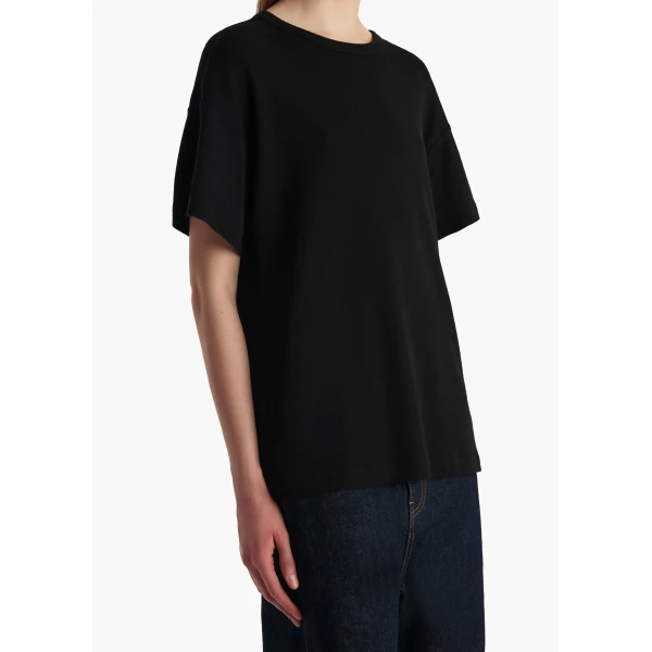 Elevate your elegance in this Khaite Tops   from the 2025 resort wear edit
