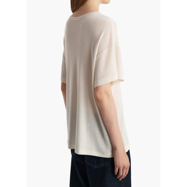 Elevate your elegance in this Khaite Tops   from the 2025 resort wear edit