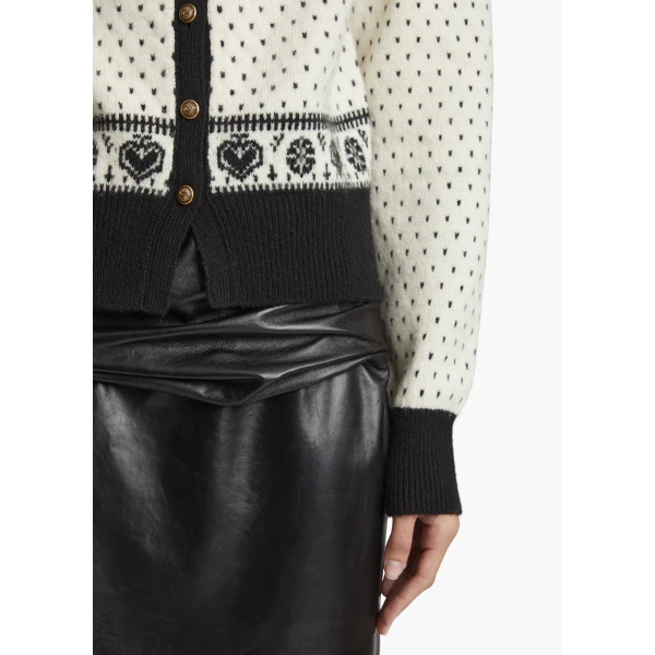Elevate your elegance in this Khaite Knitwear   from the 2025 resort wear edit